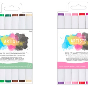 Puede incluir: Dos juegos de seis marcadores de ilustración de doble punta. El primer juego tiene marcadores verdes, marrones y beige. El segundo juego tiene marcadores morados, rosas y rojos. Ambos juegos tienen el texto "decrafts ARTISTE" y "DUAL TIP ILLUSTRATION MARKERS".