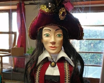 Captain Akiara, female pirate, manipulable string puppet.