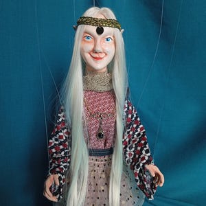Izia the light elf, a manipulable string puppet.