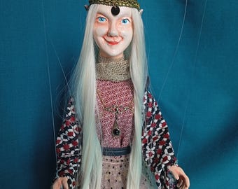 Izia the light elf, a manipulable string puppet.