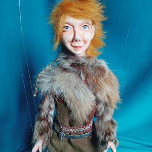 Aldaron, the princely elf lord of the trees, a manipulable string puppet