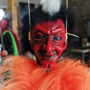 Onaï the demon of chaos, manipulatable string puppet.