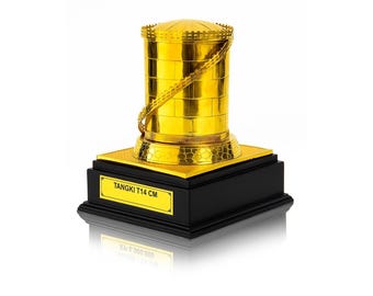 May include: A gold-colored trophy with a cylindrical top and a decorative chain, set on a black base with a gold plaque. The plaque reads "TANGKI T14 CM". The trophy is approximately 5.5 inches tall.