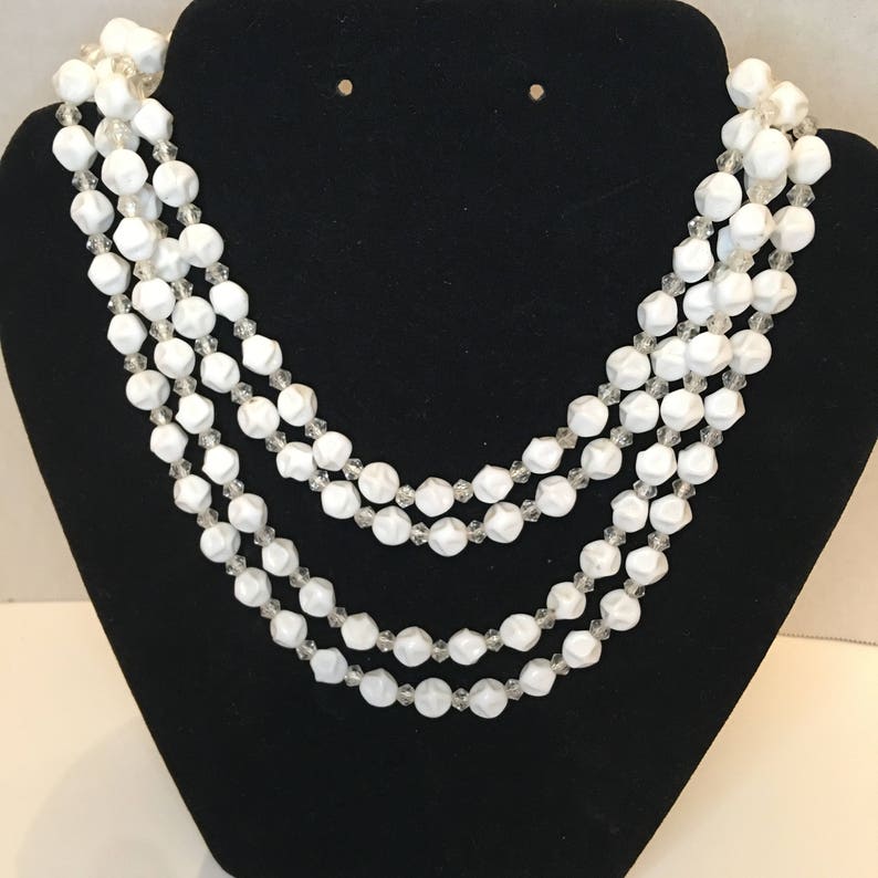 Classic Beauty Comes In This 4 Strand Beaded Necklace With Clasp.
