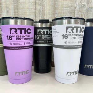 May include: Five 16 ounce RTIC Essential Pint Tumblers in different colors: green, purple, black, white, and blue. The tumblers are made of stainless steel and have a double-wall vacuum insulation to keep drinks cold or hot for hours.
