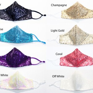 May include: Eight face masks made of sequins in various colors, including navy, champagne, turquoise, light gold, purple, coral, iridescent white, and off white.