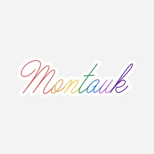 May include: A rainbow-colored sticker with the word "Montauk" written in a cursive font.