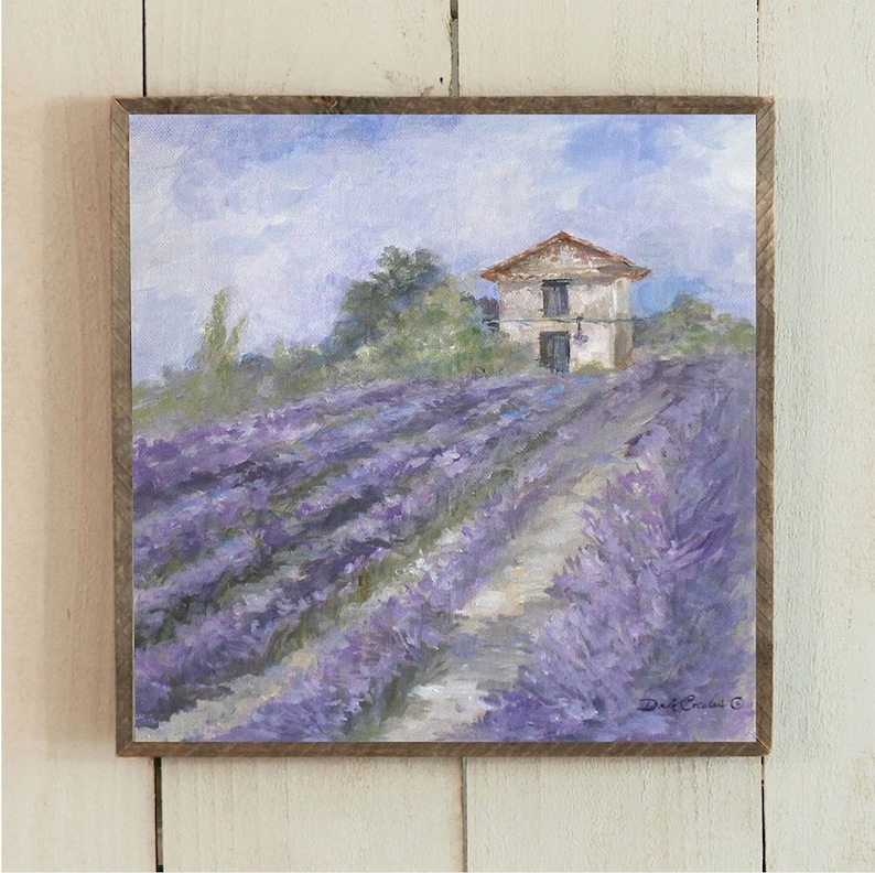 Lavender fields in full bloom on a French countryside farm, Shabby Chic and vintage rustic farmhouse and impressionistic by design. Lots of purples, tans, and blue sky with a few clouds. Green trees add to the warm feeling. By artist Debi Coules