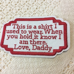 May include: Red embroidered patch with white fabric. The patch reads "This is a shirt I used to wear. When you hold it know I am there. Love, Daddy."