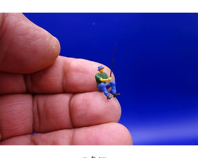 Sitting Fisher Man with Fishing Rod
