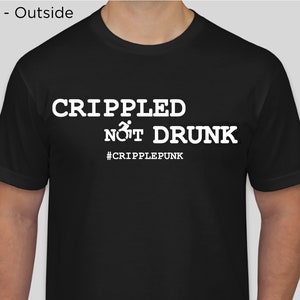 May include: Black t-shirt with white text that reads "CRIPPLED NOT DRUNK" and a wheelchair symbol. The text also includes the hashtag "#CRIPPLEPUNK".