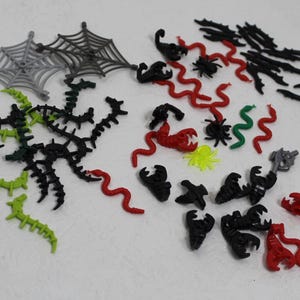 May include: A set of three ceramic mugs with a speckled, matte finish. Each mug is a different colour: light blue, cream, and grey. The mugs have a simple, modern design and a comfortable handle.