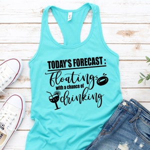 May include: A turquoise tank top with the text "TODAY'S FORECAST: floating with a chance of drinking" in black. The text includes a graphic of a cocktail glass and a pool float.