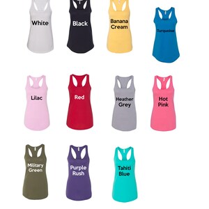 May include: Twelve different colors of women's tank tops. The colors are white, black, banana cream, turquoise, lilac, red, heather grey, hot pink, military green, purple rush, tahiti blue.