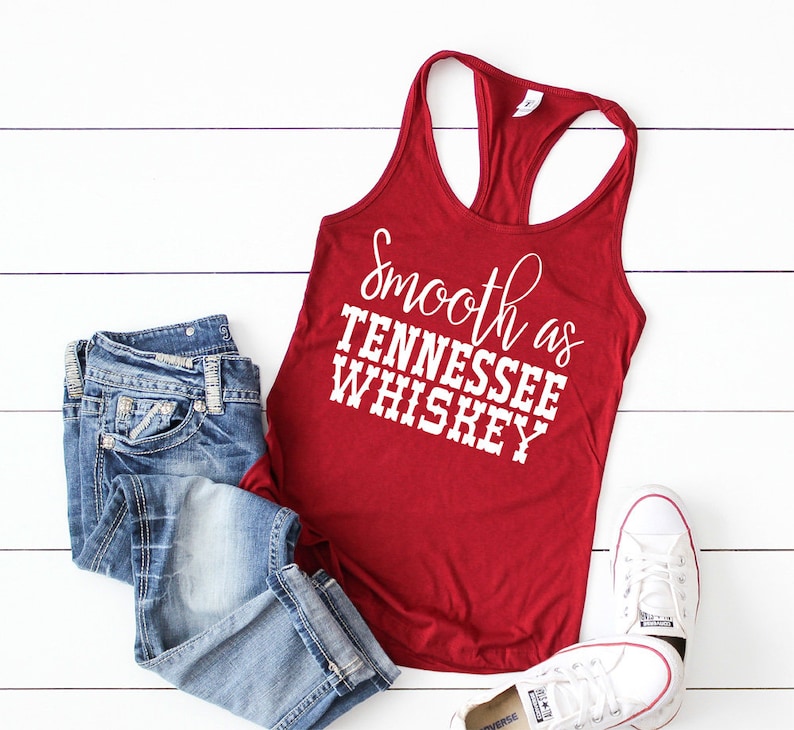 May include: Red tank top with the text "smooth as Tennessee whiskey" in white lettering.
