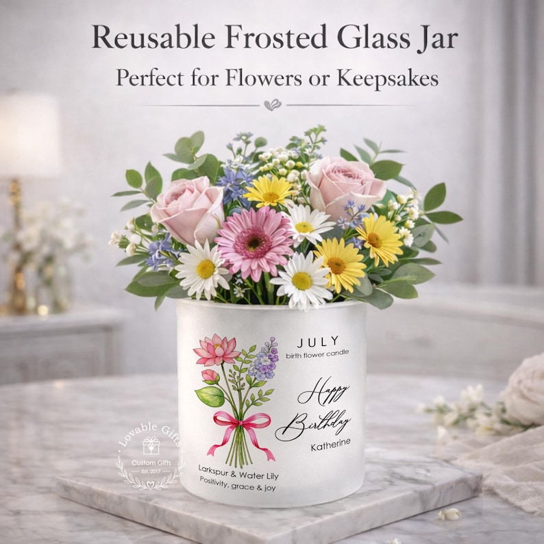 May include: A reusable frosted glass jar filled with a bouquet of pink roses, daisies, and yellow flowers. The jar has a floral design and the text "Happy Birthday Katherine". The jar is perfect for flowers or keepsakes.