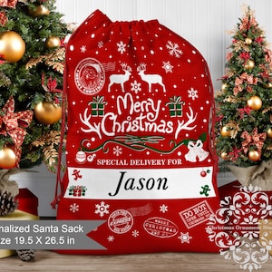 May include: A red Christmas Santa sack with white snowflakes, reindeer, and the words "Merry Christmas." It has a white stripe with the name "Jason" and is XL size, measuring 19.5 x 26.5 inches. The sack has a drawstring closure.