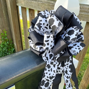 Black and white bow featuring cow print. Great for mailboxes, wreaths and much more.