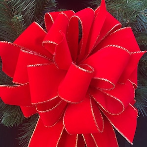 Red Velvet Bow made with wired edge ribbon. Perfect for mailboxes, wreaths, gifts, tree toppers and much more. Ideal for indoors or outdoors