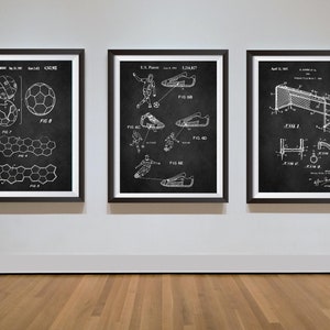 May include: Three black framed prints of vintage patent drawings for a football, football boots, and a football goal. The drawings are on a white background and the text includes the patent numbers and dates.