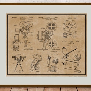 Peut inclure: Un dessin de brevet vintage en noir et blanc d'un projecteur de film. Le dessin montre les diff&eacute;rentes parties du projecteur, y compris l'objectif, la bobine de film et la source de lumi&egrave;re. Le num&eacute;ro de brevet est 1&nbsp;100&nbsp;844 et la date est le 21 ao&ucirc;t 1914.
