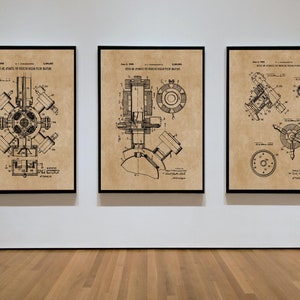 May include: Three framed patent prints displaying detailed technical drawings of machinery. The prints have a vintage aesthetic with a tan background and black ink. The frames are black, and the prints are displayed on a white wall.