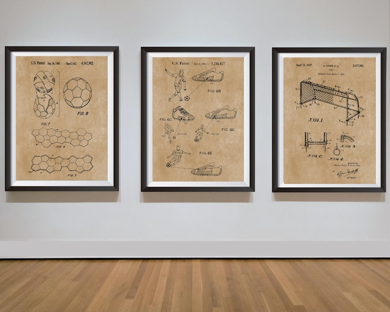 May include: Three black framed prints of vintage patent drawings for a football, football boots, and a football goal. The drawings are on a beige background with black lines.