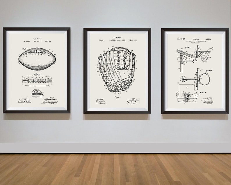 May include: Three black framed prints of vintage sports equipment patent drawings. The left print shows a football, the middle print shows a baseball glove, and the right print shows a basketball hoop.