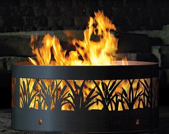 May include: A black metal fire pit with a cut-out design of reeds. The fire pit is round and has a large opening in the center. The fire pit is filled with flames.