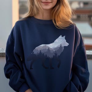 Lone Wolf Survives The Mountain Silhouette Art Unisex Sweatshirt, Wolf Sweater Gift for Nature Lovers, Outdoors Forest Wilderness Pullover
