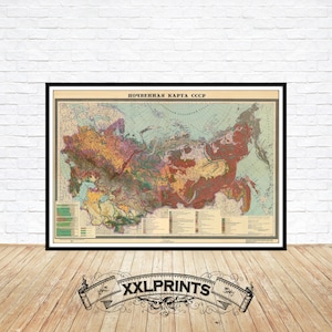 May include: A vintage map of the USSR, showing soil types. The map is printed in muted colours and has a detailed legend. The title "ПОЧВЕННАЯ КАРТА СССР" is printed at the top of the map.