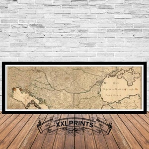 May include: A vintage map of the Black Sea region, printed in black and white on a cream-colored paper. The map shows the coastline of the Black Sea, the surrounding land, and the names of various locations, including "Mer Noire" and "Port Euxin".