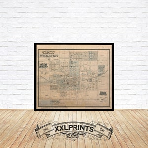 May include: A vintage map of Wheaton, Illinois, printed in black and white on a cream-colored paper. The map shows the layout of the city with streets, blocks, and buildings.