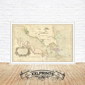 Può includere: Una mappa antica della costa dell'isola di Barbados, stampata in inchiostro nero, marrone e verde su uno sfondo crema. La mappa è intitolata "Carte de la Coste de l'Isle de la Barbade" e include una rosa dei venti e una barra di scala.