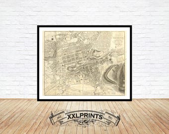 May include: A vintage black and white map of Edinburgh, Scotland, printed on paper. The map shows the city's streets, buildings, and landmarks. The title of the map is "Plan of Edinburgh and its Environs".