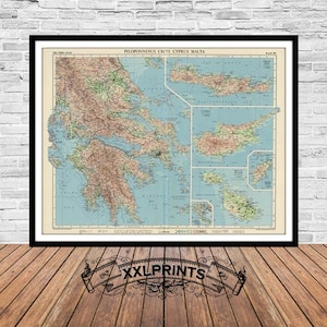 May include: A vintage map of Greece, Crete, Cyprus, and Malta. The map is printed on paper and has a blue and green color scheme. The map is framed in a black frame.