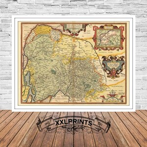 May include: An antique map of the Brabantian region of the Netherlands, printed in black and white with hand-colored details. The map shows the region's cities, towns, and rivers. The map is framed in a white frame.
