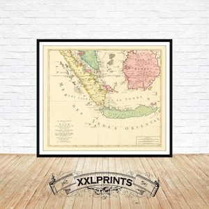 Puede incluir: Un mapa antiguo de las Indias Orientales, impreso en francés, con un título que dice "Isle de Borneo" y "Les Indes Orientales". El mapa está impreso en papel color crema y enmarcado en negro.