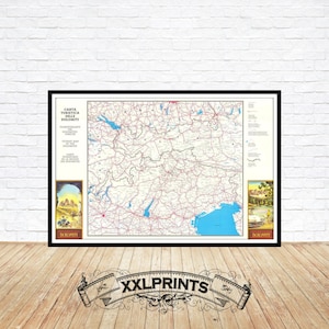 May include: A vintage map of the Dolomites in Italy, printed in black and white with red and blue accents. The map is framed in a black frame and includes two smaller images of the Dolomites on the left and right sides of the map. The text on the map reads "Carta Turistica Delle Dolomiti".