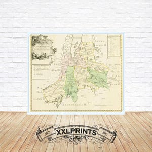 Può includere: Una mappa antica dell'area di Kronoborg in Danimarca, stampata in nero, verde e rosa su sfondo crema. La mappa mostra le diverse regioni e città dell'area, inclusa la città di Kronoborg stessa. La mappa è intitolata "Jankopings och Kronoborgs Amt" e risale al 1780.