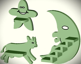 May include: Green wooden toy set with a smiling star, a crescent moon with a staircase, and a cow with a bench. The toys are painted in a light green color and have a whimsical design.