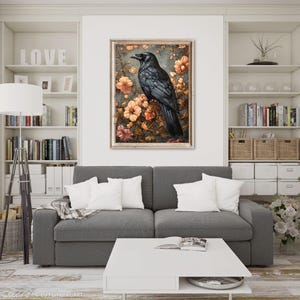 May include: A black raven perched on a branch with delicate pink and white flowers. The raven has a dark, glossy plumage and a sharp beak. The background is a soft, muted blue.