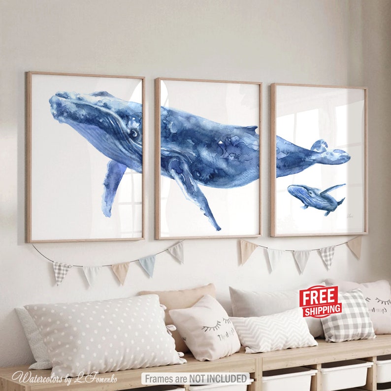 May include: Set of three watercolor paintings featuring blue whales. The largest whale is shown in two different poses, while the third painting features a smaller whale swimming alongside the larger whale.