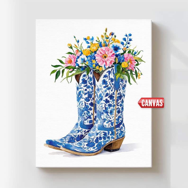 May include: Watercolor painting of blue and white cowboy boots filled with colorful flowers. The boots have a floral pattern and are set against a white background. The word "CANVAS" is in a red banner.