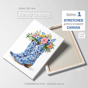 May include: A stretched canvas art print featuring blue and white cowboy boots filled with colorful flowers. The boots have a floral pattern. The canvas is 1.25 inches deep and ready to hang.