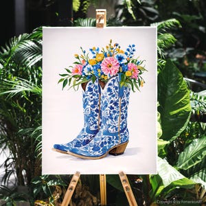 May include: Watercolor painting of blue and white cowboy boots filled with colorful flowers. The boots have a floral pattern and are set against a white background. The flowers are pink, yellow, and blue.
