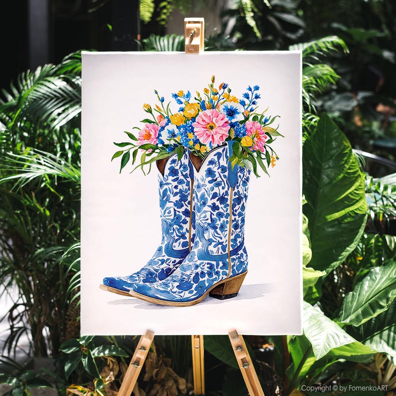 May include: Watercolor painting of blue and white cowboy boots filled with colorful flowers. The boots have a floral pattern and are set against a white background. The flowers are pink, yellow, and blue.