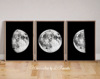 May include: Three black and white watercolor paintings of the moon in different phases. The first painting shows a full moon, the second shows a full moon with a slight crescent shape, and the third shows a half moon.