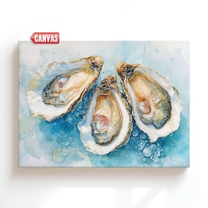 May include: Canvas art print featuring three open oysters on a blue watercolor background. The oysters have a creamy interior and are surrounded by a light blue and white watercolor wash. The word "CANVAS" is printed on a red tag in the upper left corner.