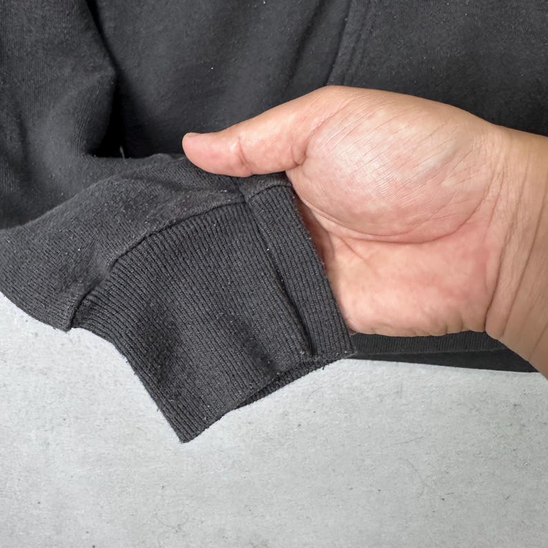 May include: A set of three ceramic mugs with a speckled, matte finish. Each mug is a different colour: light blue, cream, and grey. The mugs have a simple, modern design and a comfortable handle.